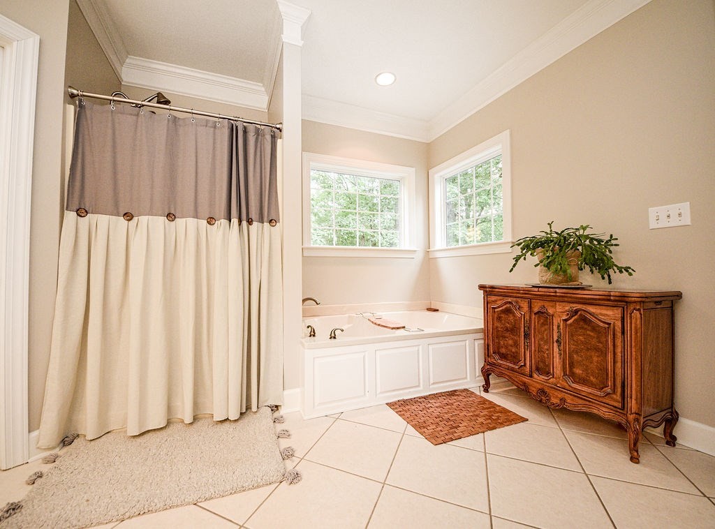 619 Eads Bluff Road Northwest Georgetown, TN 37336 - Photo 37 of 67 a bathroom with a bathtub a sink and a shower
