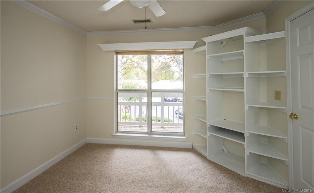 1129 Torrence Circle, Unit 1129 Davidson, NC 28036 - Photo 17 of 20 a view of an empty room with a window