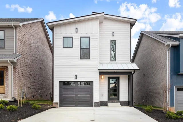 a front view of a house with garage
