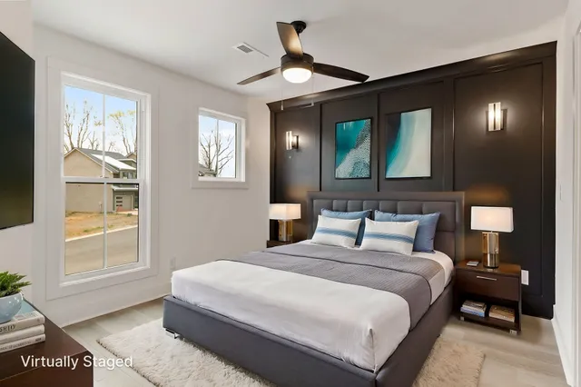 a bedroom with a large bed and a window