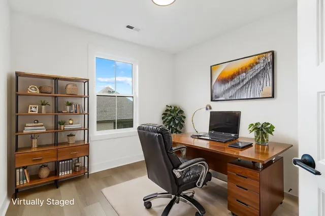 a view of a workspace with furniture