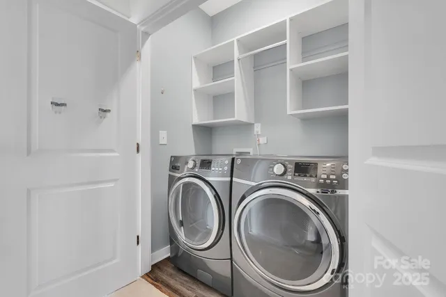 a utility room with sink dryer and washer