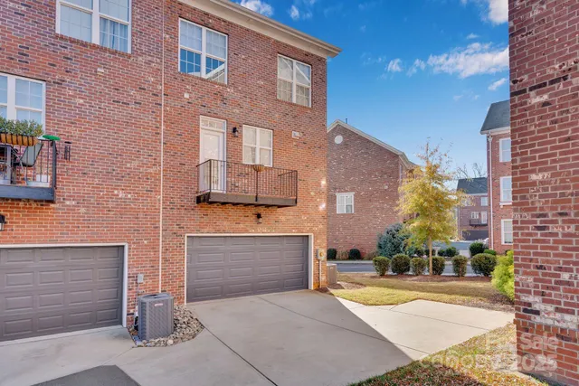a front view of a building with garage