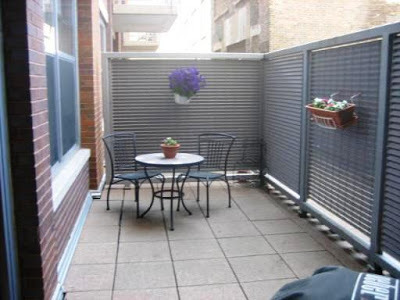 933 West Van Buren Street, Unit 321 Chicago, IL 60607 - Photo 16 of 18 a backyard of a house with table and chairs
