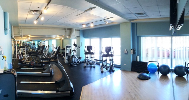 933 West Van Buren Street, Unit 321 Chicago, IL 60607 - Photo 18 of 18 a gym room with lots of furniture and a large window