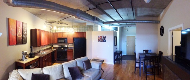 933 West Van Buren Street, Unit 321 Chicago, IL 60607 - Photo 4 of 18 a living room with furniture and a flat screen tv