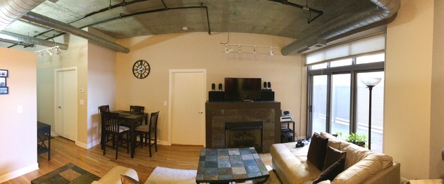 933 West Van Buren Street, Unit 321 Chicago, IL 60607 - Photo 6 of 18 a living room with furniture and a fireplace