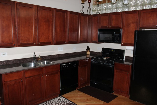 933 West Van Buren Street, Unit 321 Chicago, IL 60607 - Photo 7 of 18 a kitchen with a sink and a stove