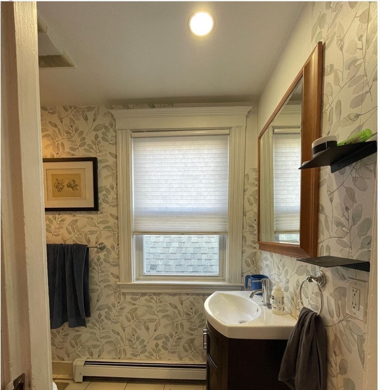 1672 Beacon Street, Unit 3B Brookline, MA 02445 - Photo 3 of 7 a bathroom with a sink and a mirror