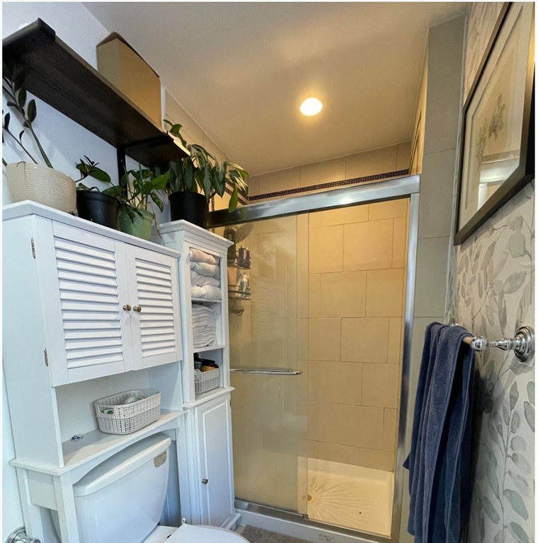 1672 Beacon Street, Unit 3B Brookline, MA 02445 - Photo 4 of 7 a bathroom with a shower and a sink