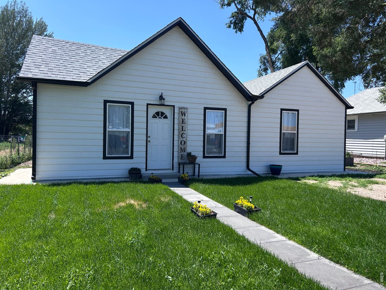 809 Warren Street Weldona, CO 80653 - Photo 1 of 19 a view of a back yard of the house