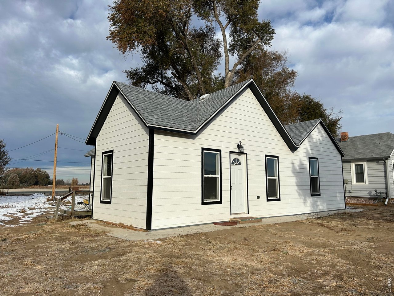 809 Warren Street Weldona, CO 80653 - Photo 18 of 19 a view of a house with a backyard