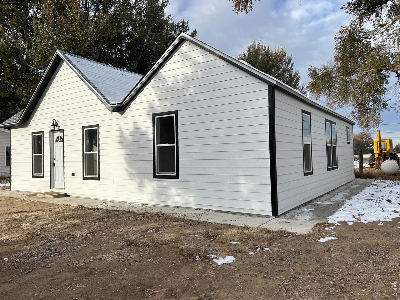 809 Warren Street Weldona, CO 80653 - Photo 19 of 19 a view of a small house with a garage