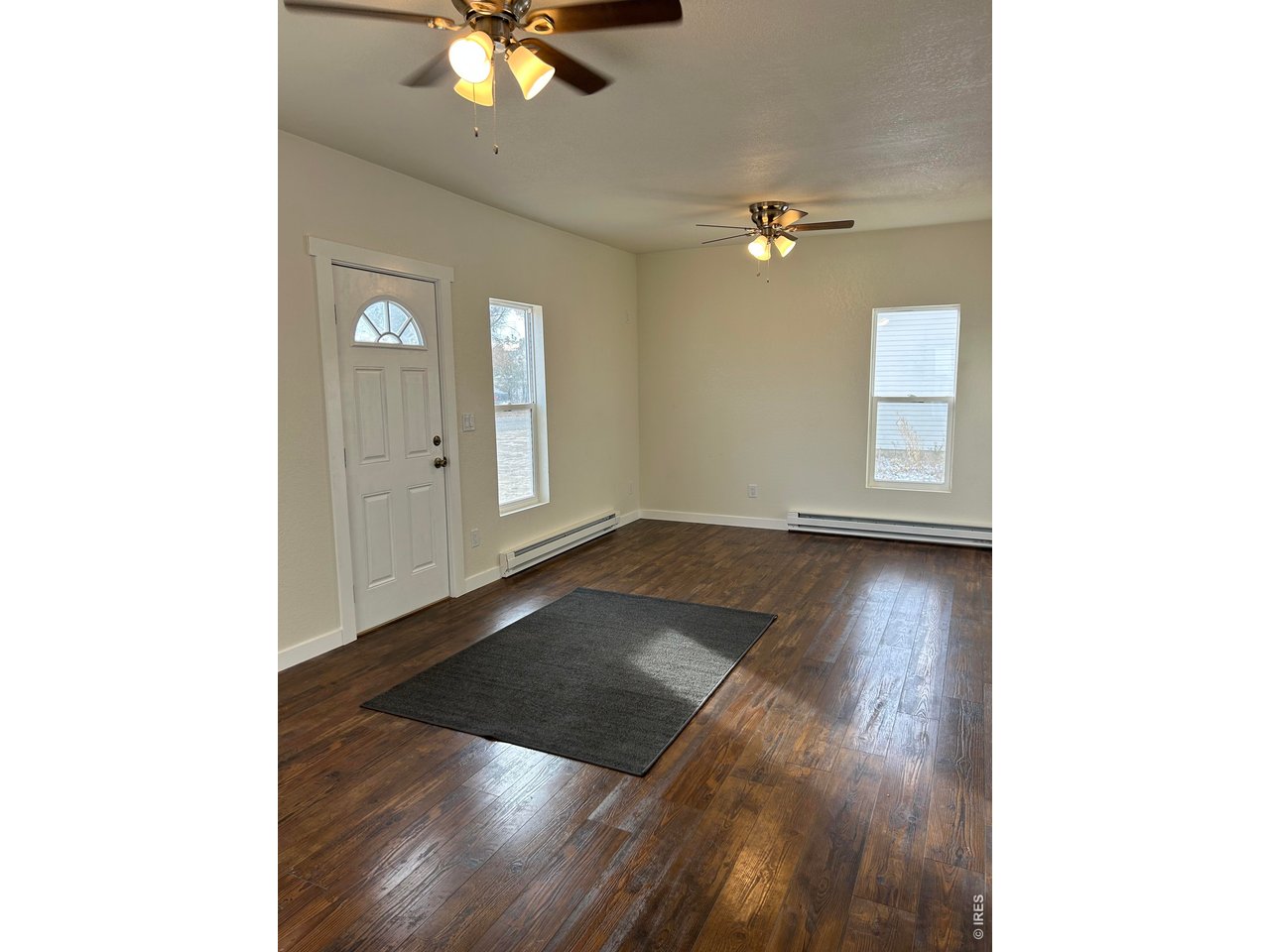 809 Warren Street Weldona, CO 80653 - Photo 2 of 19 a view of an empty room with a window