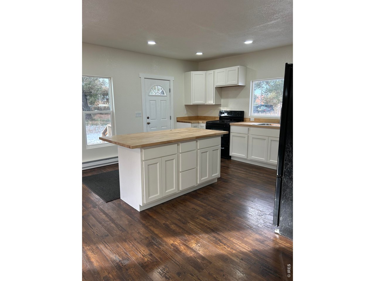 809 Warren Street Weldona, CO 80653 - Photo 7 of 19 a kitchen with a sink and cabinets