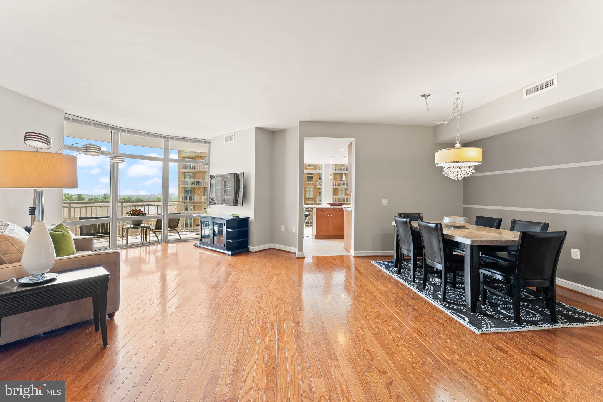 11990 Market Street, Unit 701 Reston, VA 20190 - Photo 11 of 93 a view of a dining room with furniture window and wooden floor