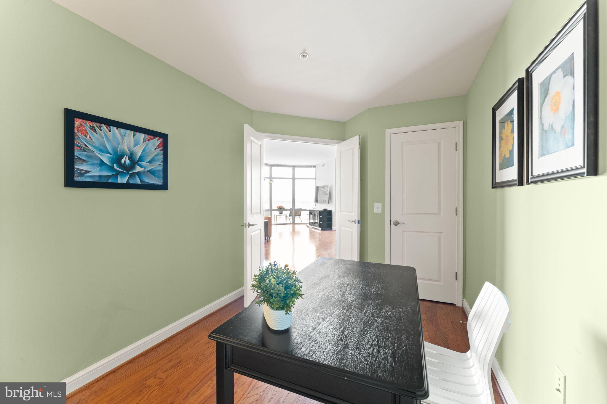 11990 Market Street, Unit 701 Reston, VA 20190 - Photo 14 of 93 a living room with furniture and wooden floor