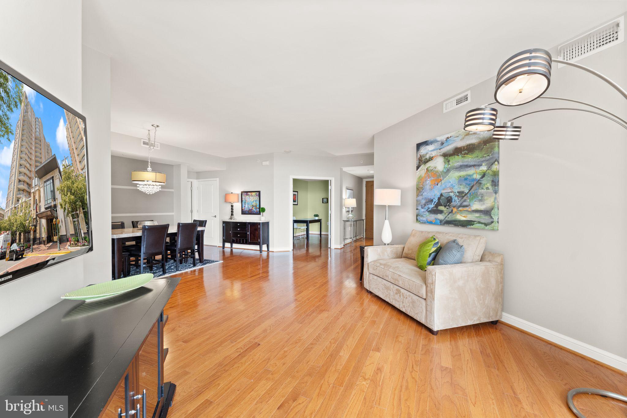 11990 Market Street, Unit 701 Reston, VA 20190 - Photo 18 of 93 a living room with fireplace furniture and a flat screen tv
