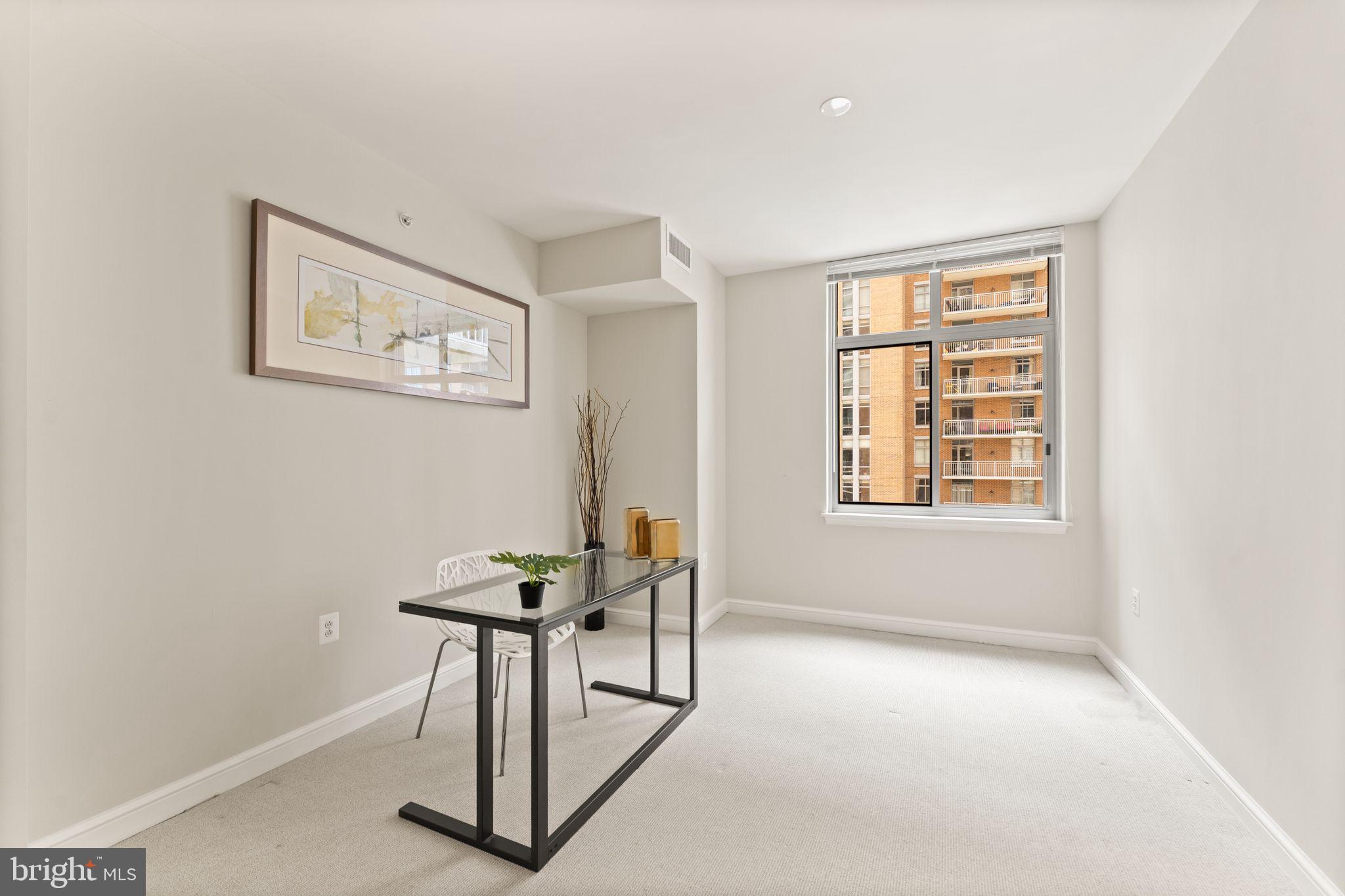 11990 Market Street, Unit 701 Reston, VA 20190 - Photo 22 of 93 a view of a livingroom with furniture and a window