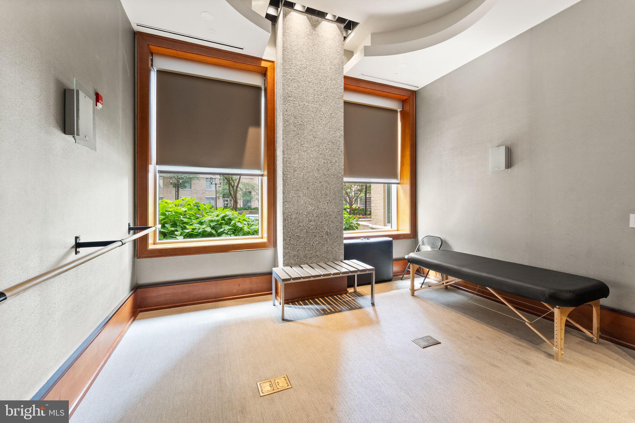 11990 Market Street, Unit 701 Reston, VA 20190 - Photo 59 of 93 a living room with a fireplace furniture and a large window