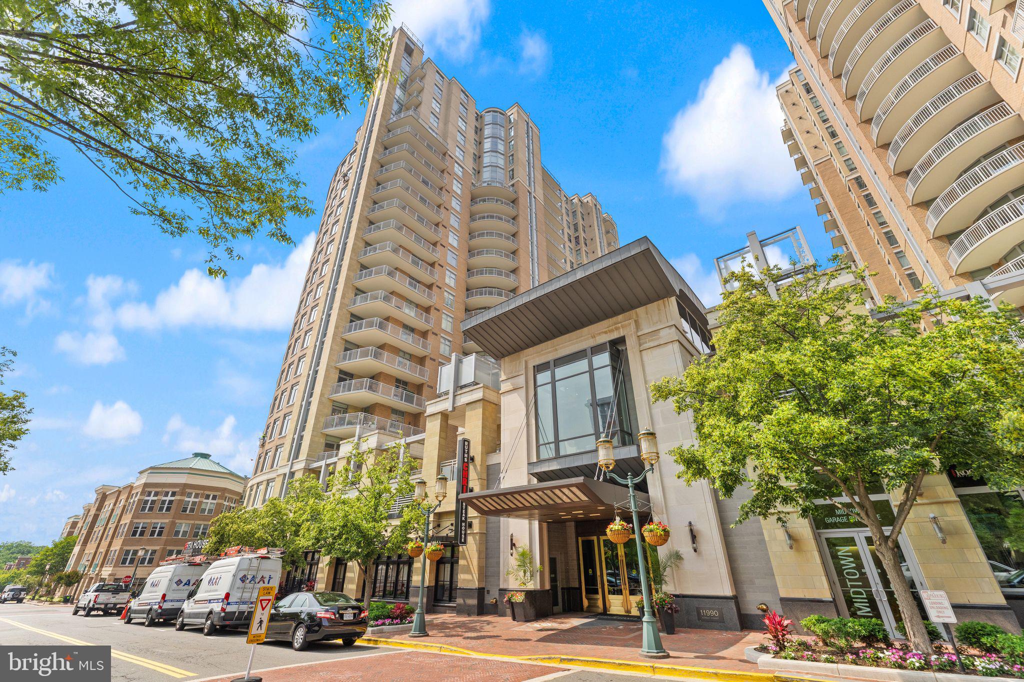 11990 Market Street, Unit 701 Reston, VA 20190 - Photo 6 of 93 a view of a tall building next to a road