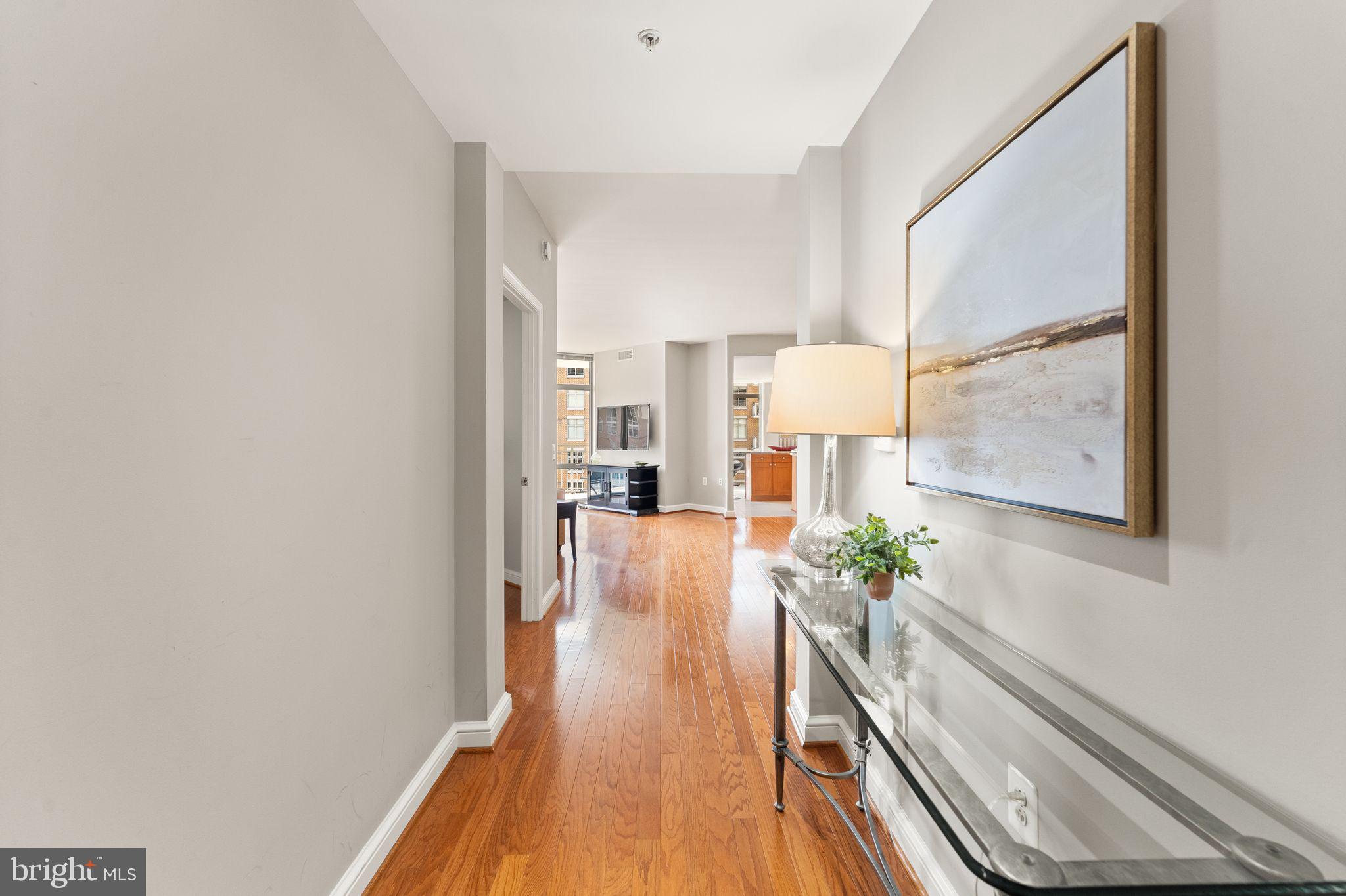 11990 Market Street, Unit 701 Reston, VA 20190 - Photo 9 of 93 a view of a living room and a potted plant