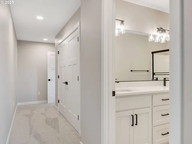 a bathroom with a sink a mirror and a shower