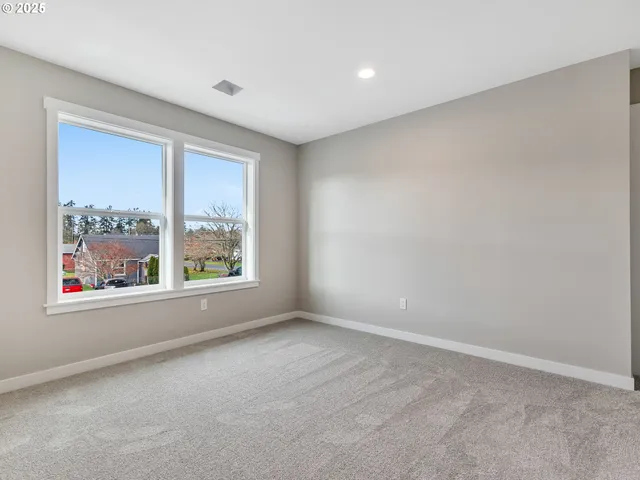 a bathroom with a tub sink toilet and mirror