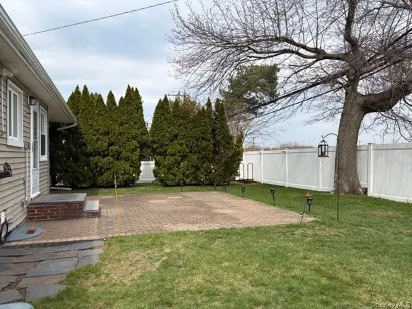 a backyard of a house with lots of green space