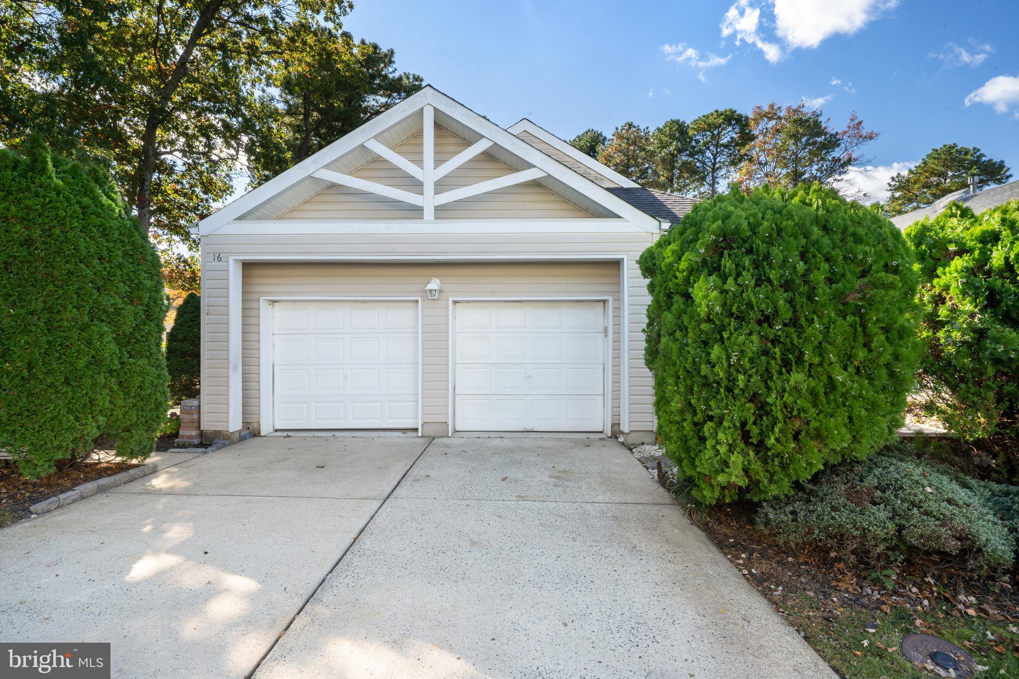 16 Newport Road Manahawkin, NJ 08050 - Photo 1 of 36 a front view of a house with garden