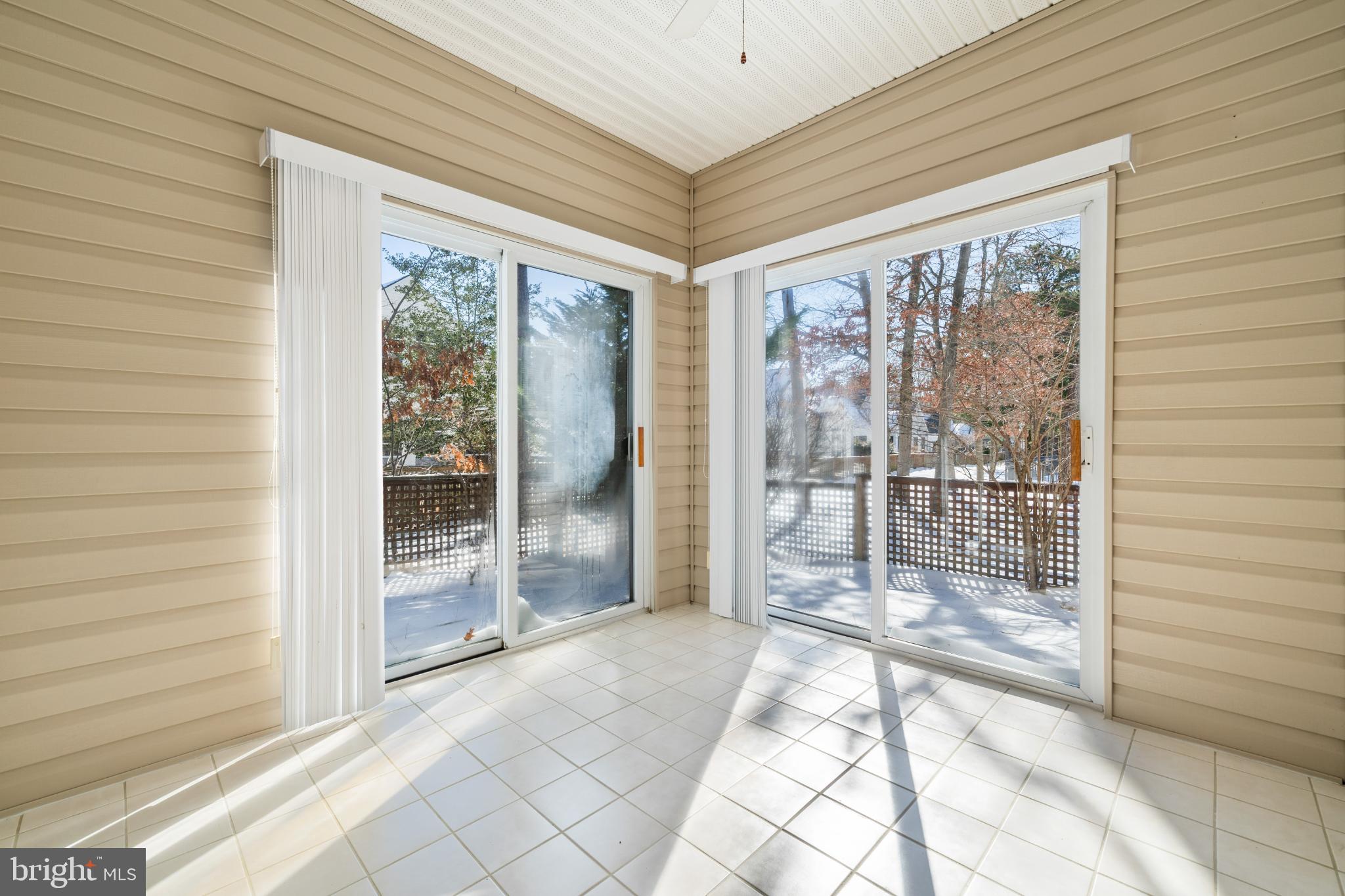 16 Newport Road Manahawkin, NJ 08050 - Photo 11 of 29 Bright sunroom with serene outdoor views.