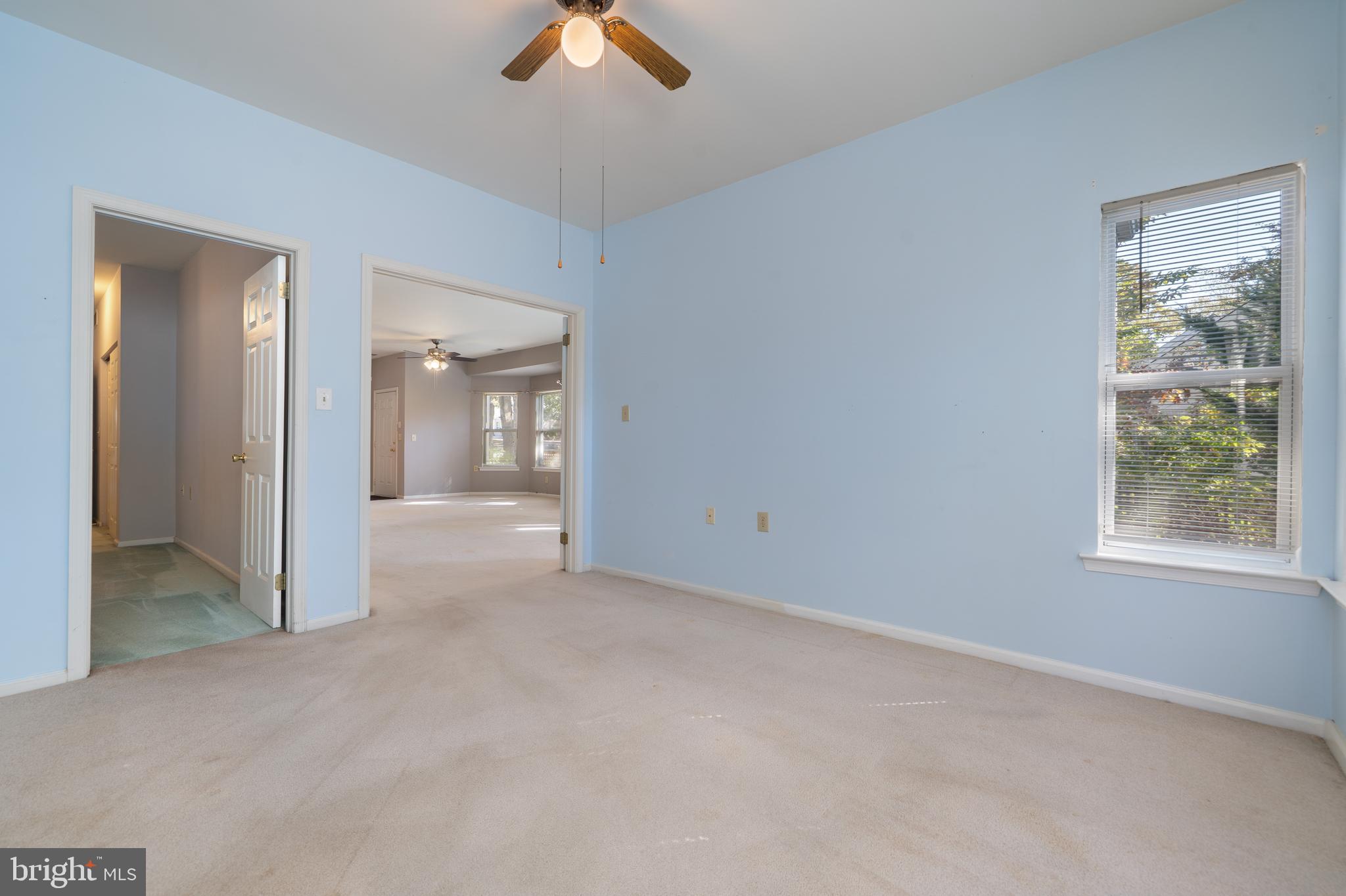 16 Newport Road Manahawkin, NJ 08050 - Photo 14 of 36 a view of a big room with windows and chandelier fan