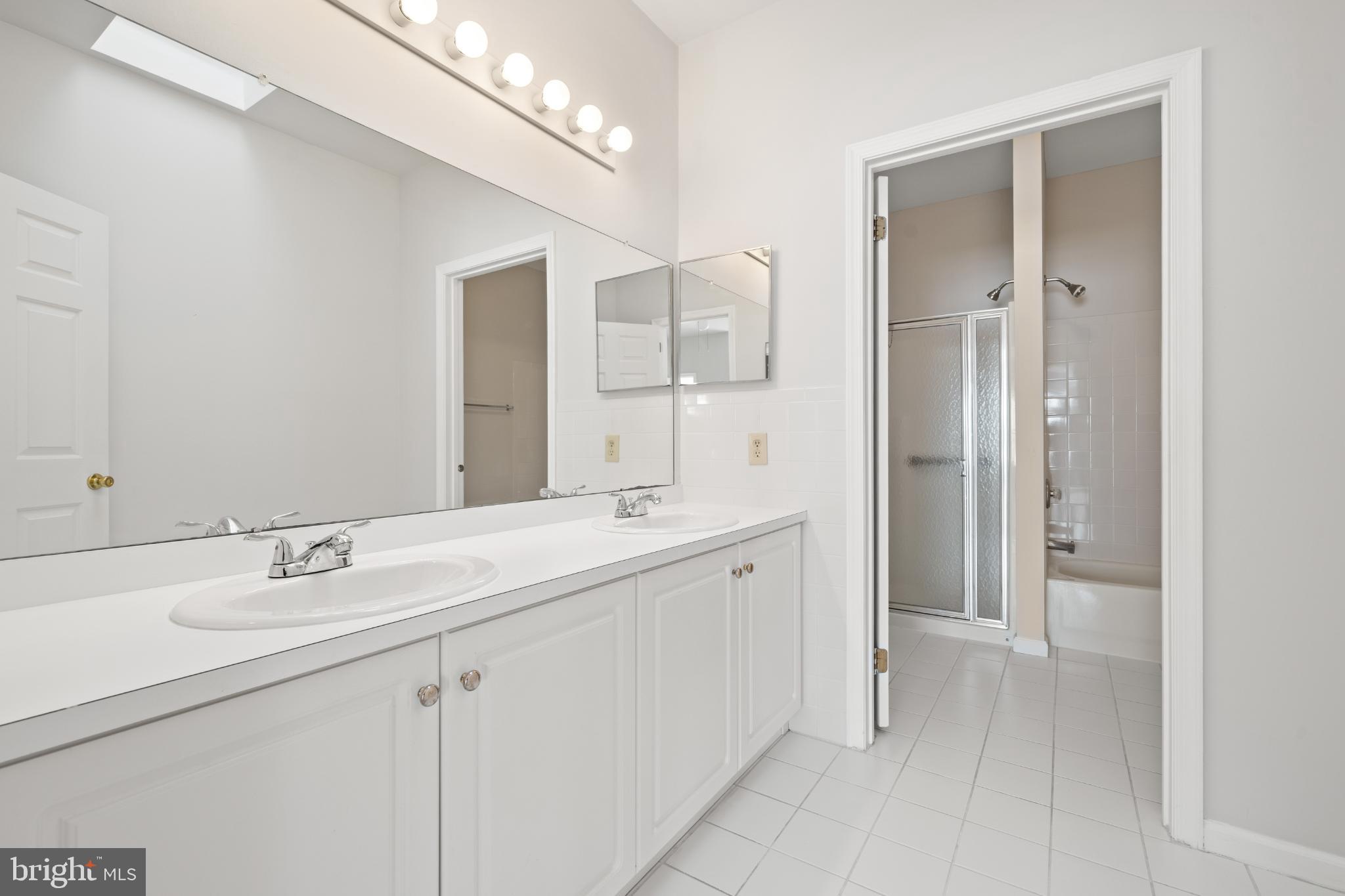 16 Newport Road Manahawkin, NJ 08050 - Photo 16 of 29 Spacious, modern bathroom with sleek finishes.