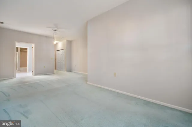 a spacious bathroom with a bathtub and a toilet