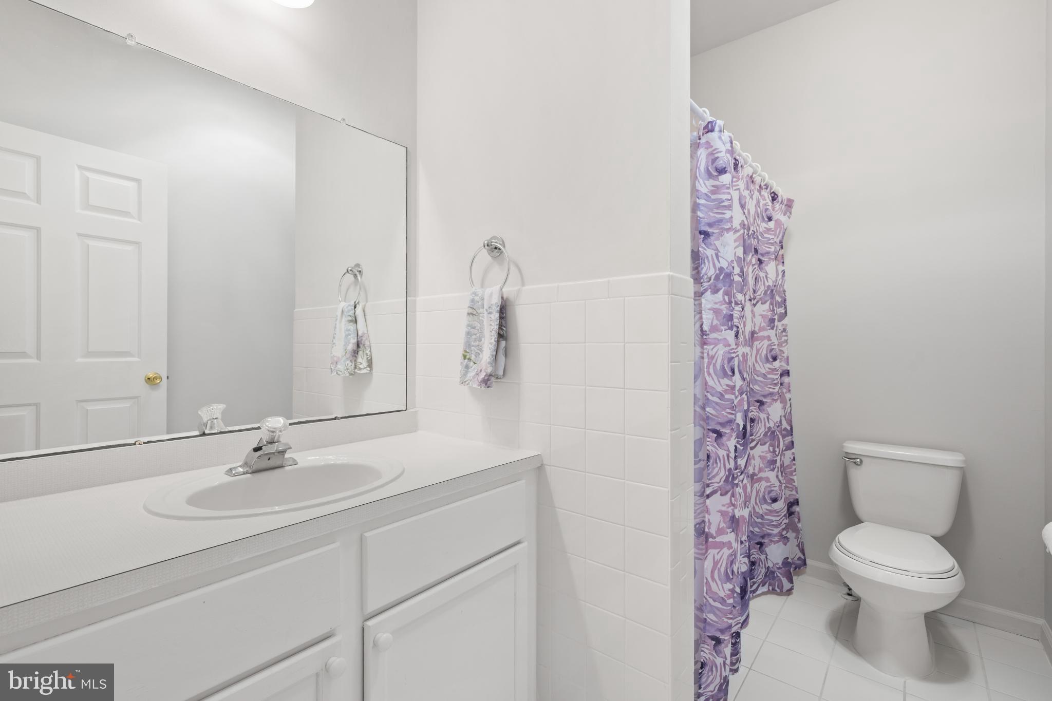 16 Newport Road Manahawkin, NJ 08050 - Photo 19 of 29 Bright and airy bathroom with floral accents.