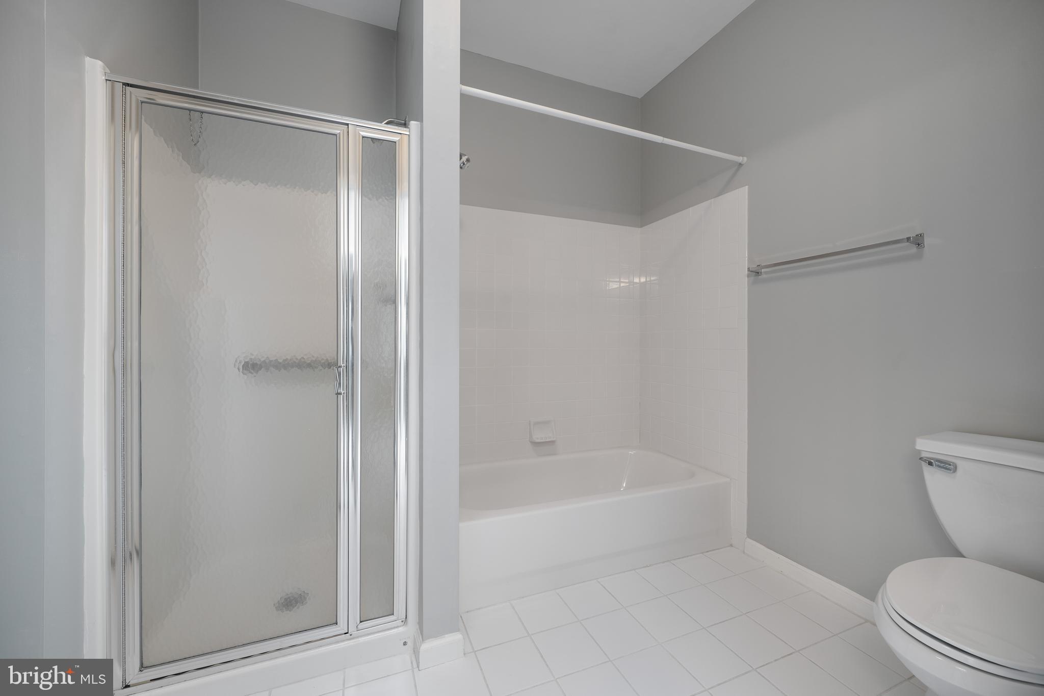 16 Newport Road Manahawkin, NJ 08050 - Photo 19 of 36 a spacious bathroom with a bathtub and a toilet