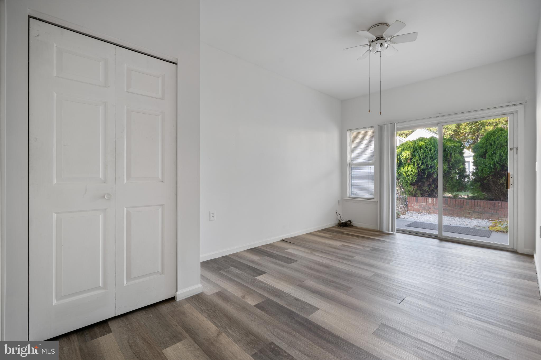 16 Newport Road Manahawkin, NJ 08050 - Photo 20 of 36 a view of an empty room with wooden floor and a window