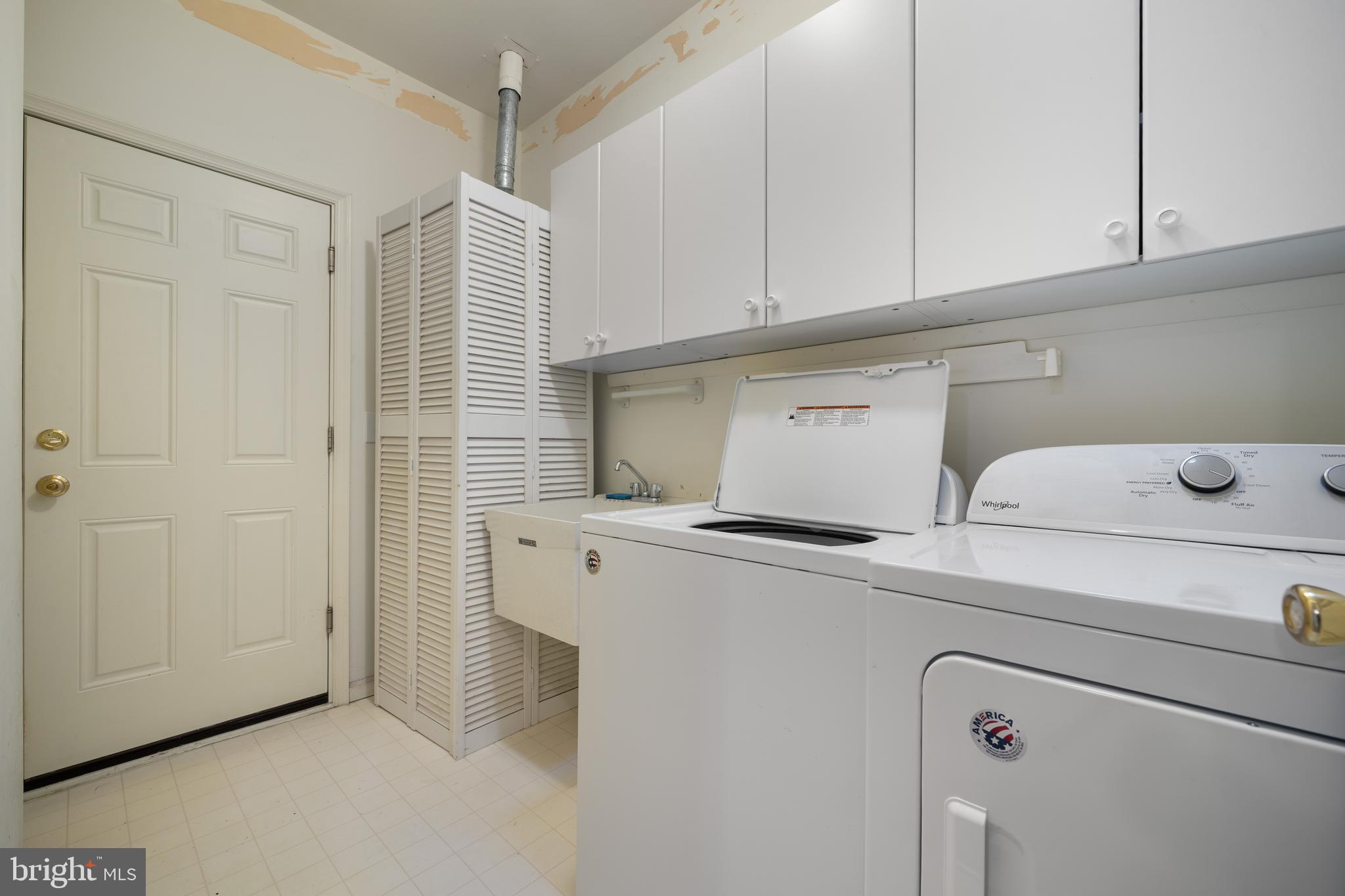 16 Newport Road Manahawkin, NJ 08050 - Photo 22 of 36 a view of storage and utility room with washer and dryer