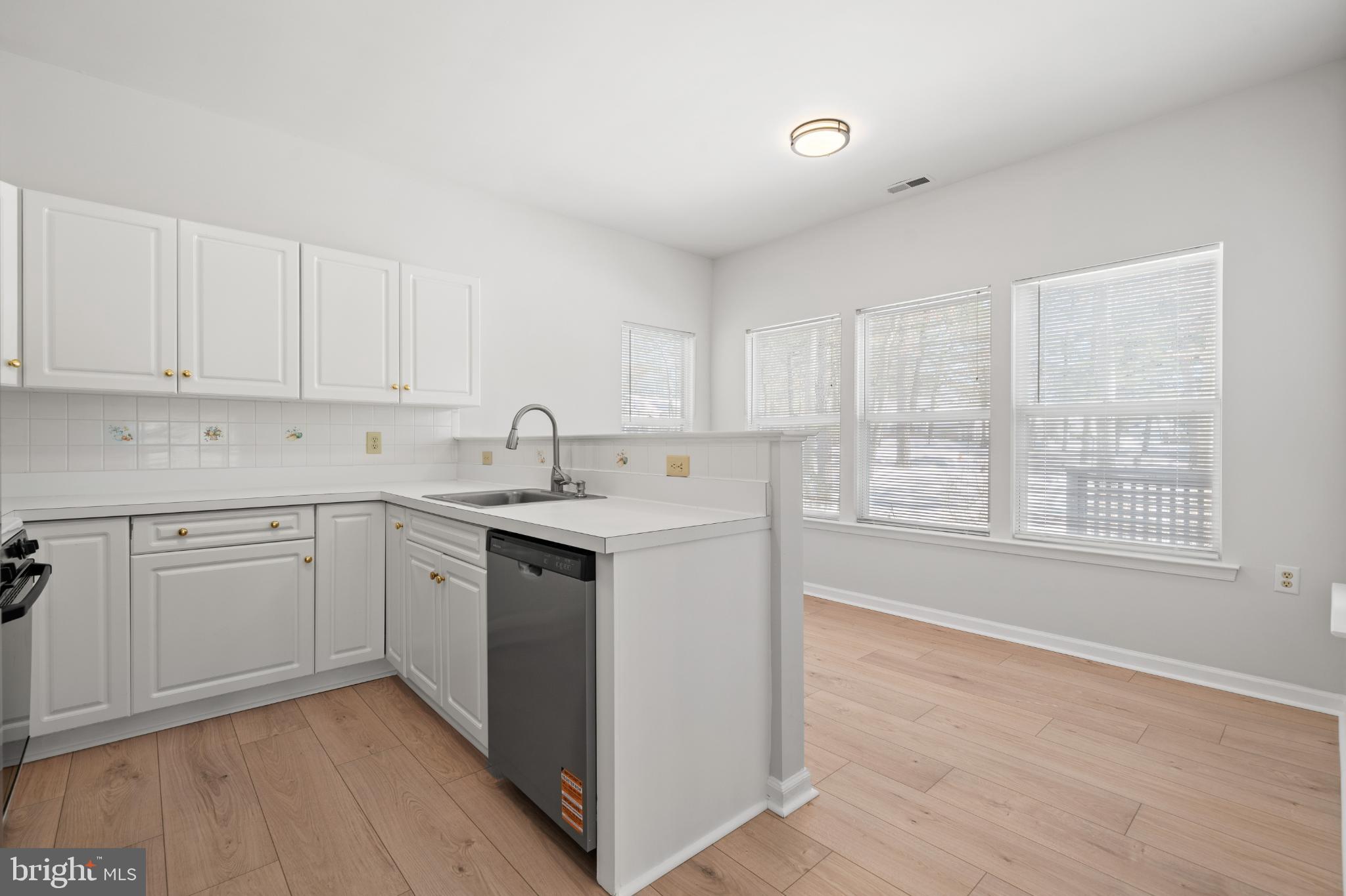 16 Newport Road Manahawkin, NJ 08050 - Photo 4 of 29 Bright and airy kitchen with modern finishes.