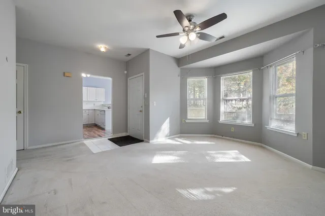 a kitchen with granite countertop a sink stove and cabinets