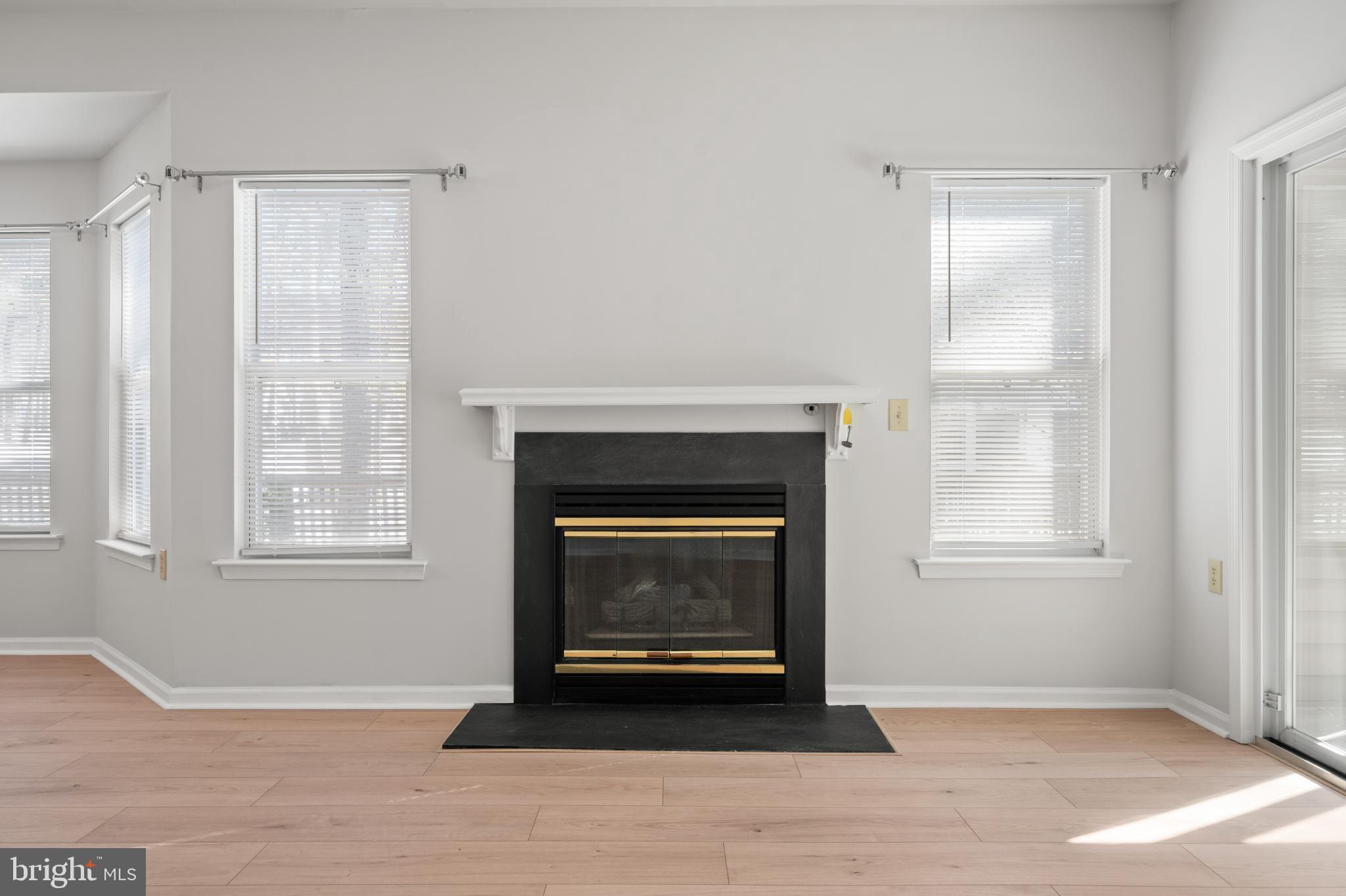 16 Newport Road Manahawkin, NJ 08050 - Photo 10 of 29 Bright and airy space with a cozy fireplace.