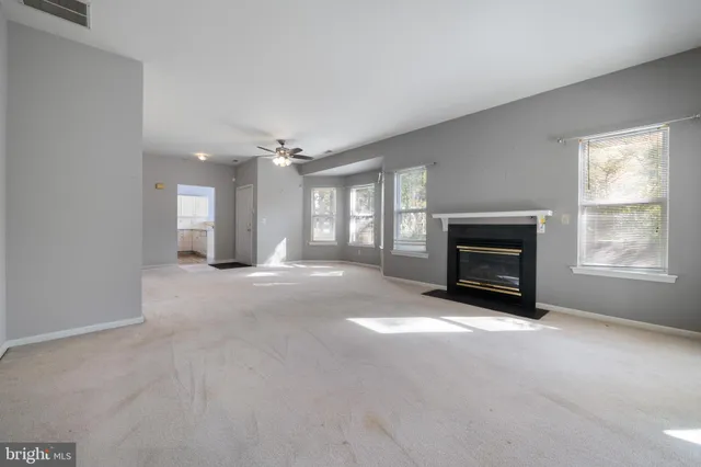a living room with a fireplace