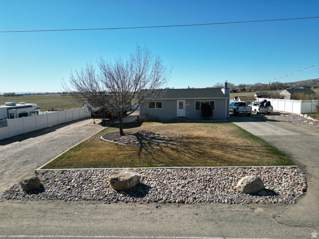 1852 East 3500th Street South Vernal, UT 84078 - Photo 30 of 46 Single story home featuring driveway and a chimney