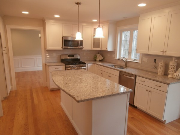 81 Bellevue Road Andover, MA 01810 - Photo 5 of 11 a kitchen with stainless steel appliances granite countertop a sink a stove and a wooden floors