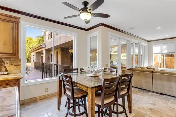 a kitchen with stainless steel appliances granite countertop a sink a stove and refrigerator
