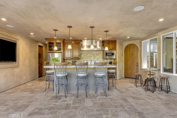 a living room with granite countertop furniture and a window