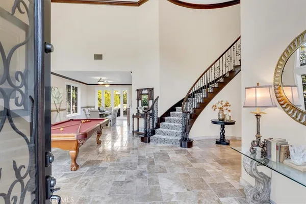a living room with furniture a window and a fireplace