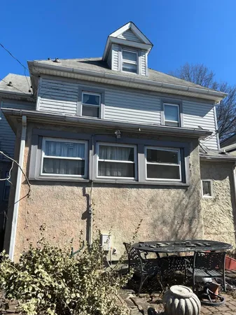front view of a house with a balcony