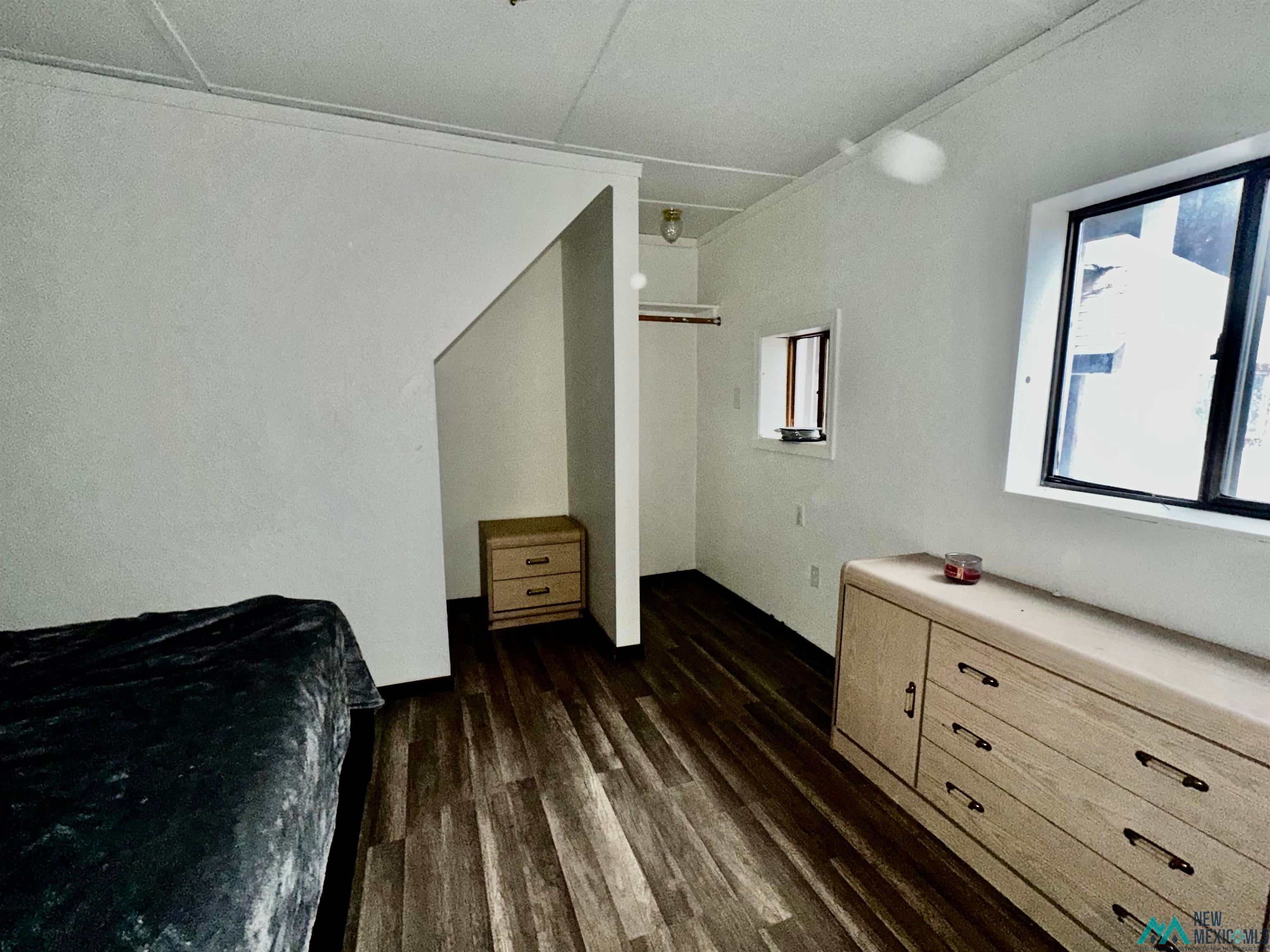 31 Bill Knight Gap Road Luna, NM 87824 - Photo 29 of 41 Bedroom featuring dark wood-style floors
