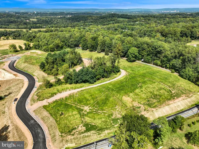 a view of a swimming pool with a yard